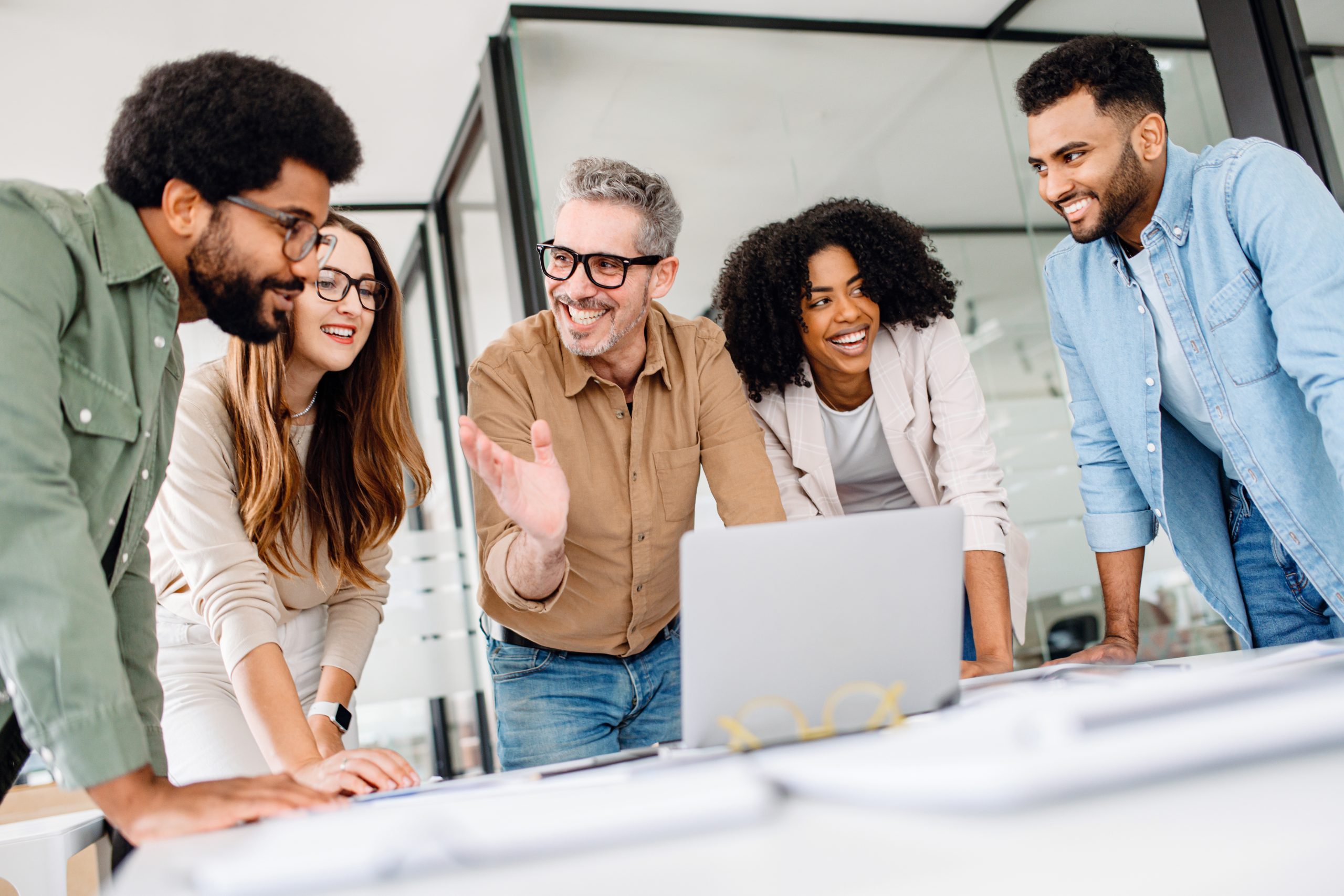 Business team collaborating with an AI concept displayed in a meeting room